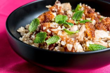 Homemade Chinese fried rice with vegetables and fried eggs