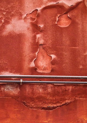 Face shape on red wall