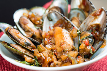Mussel with white wine sauce on table