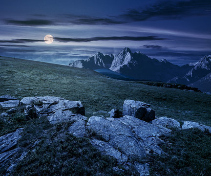 rocky peaks and rocks on hillside at night