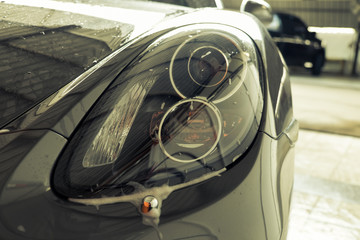 Modern car headlights on isolated white scenes