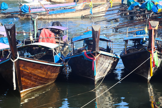 Thai fishing boat parked at dawn pier.