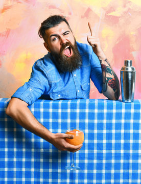 Brutal caucasian hipster holding tropical alcohol fresh cocktail