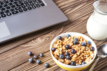 Healthy breakfast and laptop before work