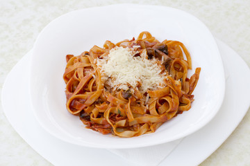 Penne pesto.Penne, tomato sauce and vegetables on white background