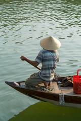 The boatwoman  on the old national vietnamese boat