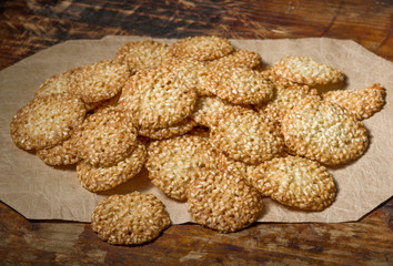 Cookies with sesame  on vintage wooden background
