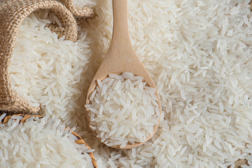 Jasmine rice on wooden scoop