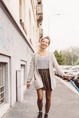 Obraz premium Asian beautiful young woman outdoor in the city listening music with earphones and smart phone hand hold - relaxing, music, enjoying concept