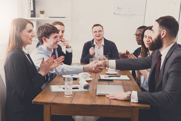 Business handshake at office meeting, contract conclusion
