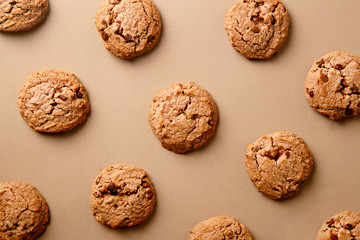 Cookies pattern on the neutral background. Top view of chocolate chip cookies