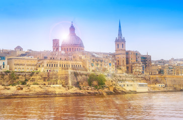 Fototapeta premium Old medieval architecture of Valletta village at sunset, Malta