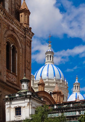 Fototapeta na wymiar The domes of the New Cathedral in Cuenca, Ecuador. These are the famous view that are usually found on all travel brochures for the city.