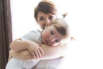 family mother playing with toddler baby