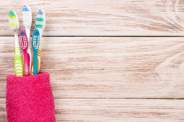 toothbrushes on the white wooden background with copy space for your text. Top view