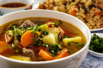 Vegetable soup shurpa with meat - a traditional dish of the inhabitants of Central Asia. Closeup