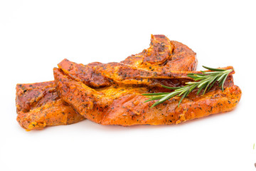 Spicy marinated spare ribs barbecued on the white background.