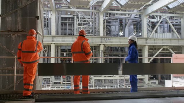  Time lapse of busy team of engineers working together inside power station
