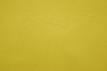 Warm tone yellow cement wall background clean vintage style and empty space for text, For web design or graphic art image and photography studio backdrop.