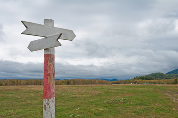 Empty wooden road pointer