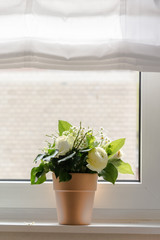 Bouquet of Flowers on a Window Sill
