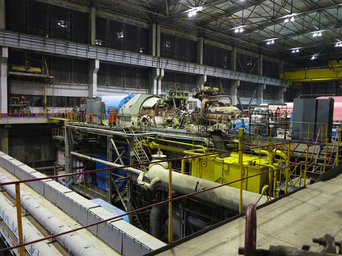 Steam turbine during repair, machinery, pipes, tubes at a power plant