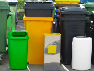 Many different colorful garbage bin containers