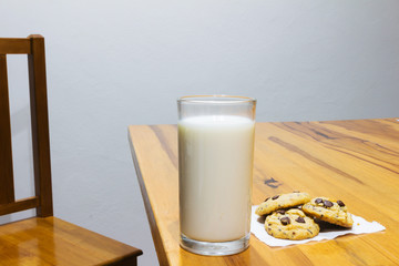 milk and cookie  on a wooden background. floor table