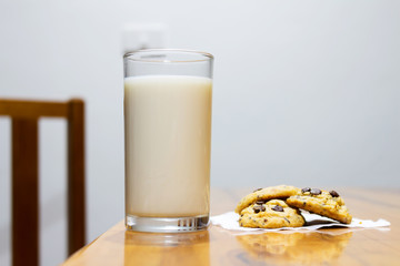 milk and cookie  on a wooden background. floor table