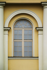 Fototapeta premium Facade of a window of an old building in the center of the city.