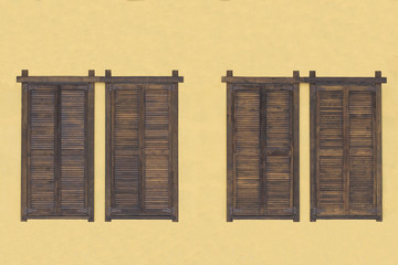Rustic brown wooden window shutters with old stone wall yellow background.