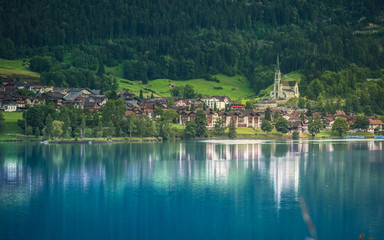 Fototapeta na wymiar Alpine village above the lake, Lungren, Swiss