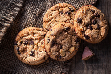 Chocolate chip cookies,  freshly baked on rustic wooden table. Selective Focus. Copy space.