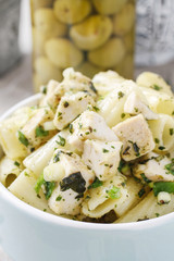 Mediterranean chicken salad with vegetables and penne.