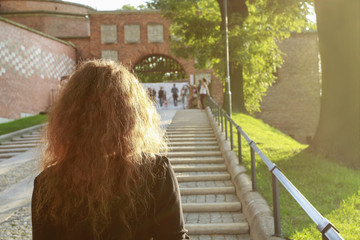 Woman taking a walk in the sunset.