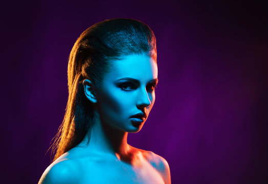 Portrait of a beautiful, seductive and young girl. Mixed and fashionable lightning effect.