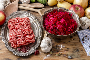 Raw pork and beef ground meat and beetroot and sauerkraut salad.