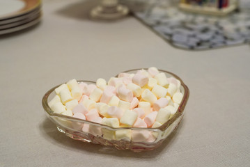 White marshmallows close up in a bowl