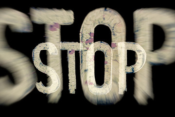 The word stop in blury white letters