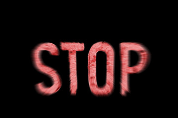 The word stop in blury red letters.