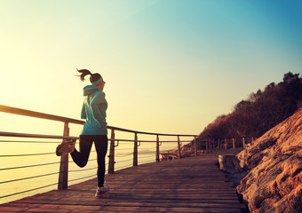 Runner athlete running at seaside. woman fitness jogging workout wellness concept