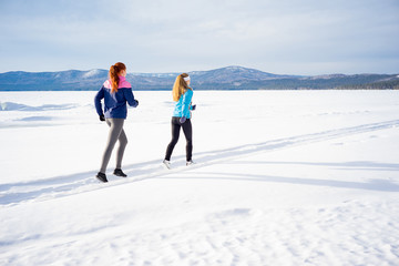 Fototapeta na wymiar Two girls jogging