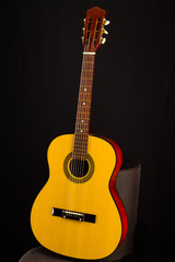 Naklejka premium An acoustic guitar waiting to be played