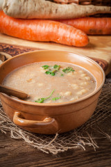 Mushroom soup on a wooden table.