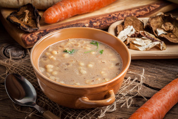 Mushroom soup on a wooden table.