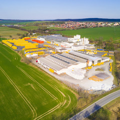 Aerial view of factory plant producing autoclaved aerated concrete. Top view of industrial area.