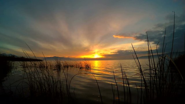 Lake rippling as the Sun is setting over Utah Lake.