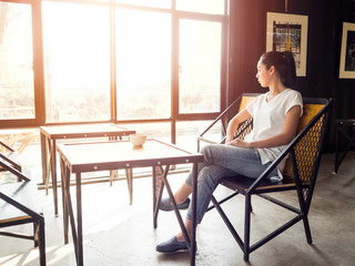 Woman takes a rest in cafe.