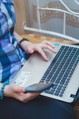 Close-up of smartphone with blank screen in female hands.Girl using digital gadget.