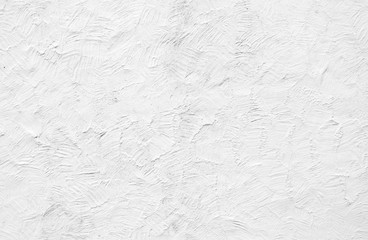 Rough white painted rendering on exterior wall